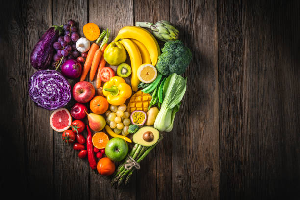 istockphoto-1285827086-612x612 Vegetables and fruit with heart shape as concept of cardiovascular health on wooden rustic table